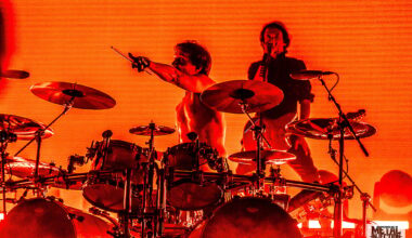 A photo of Mario Duplantier and Joe Duplantier from Gojira live on stage.