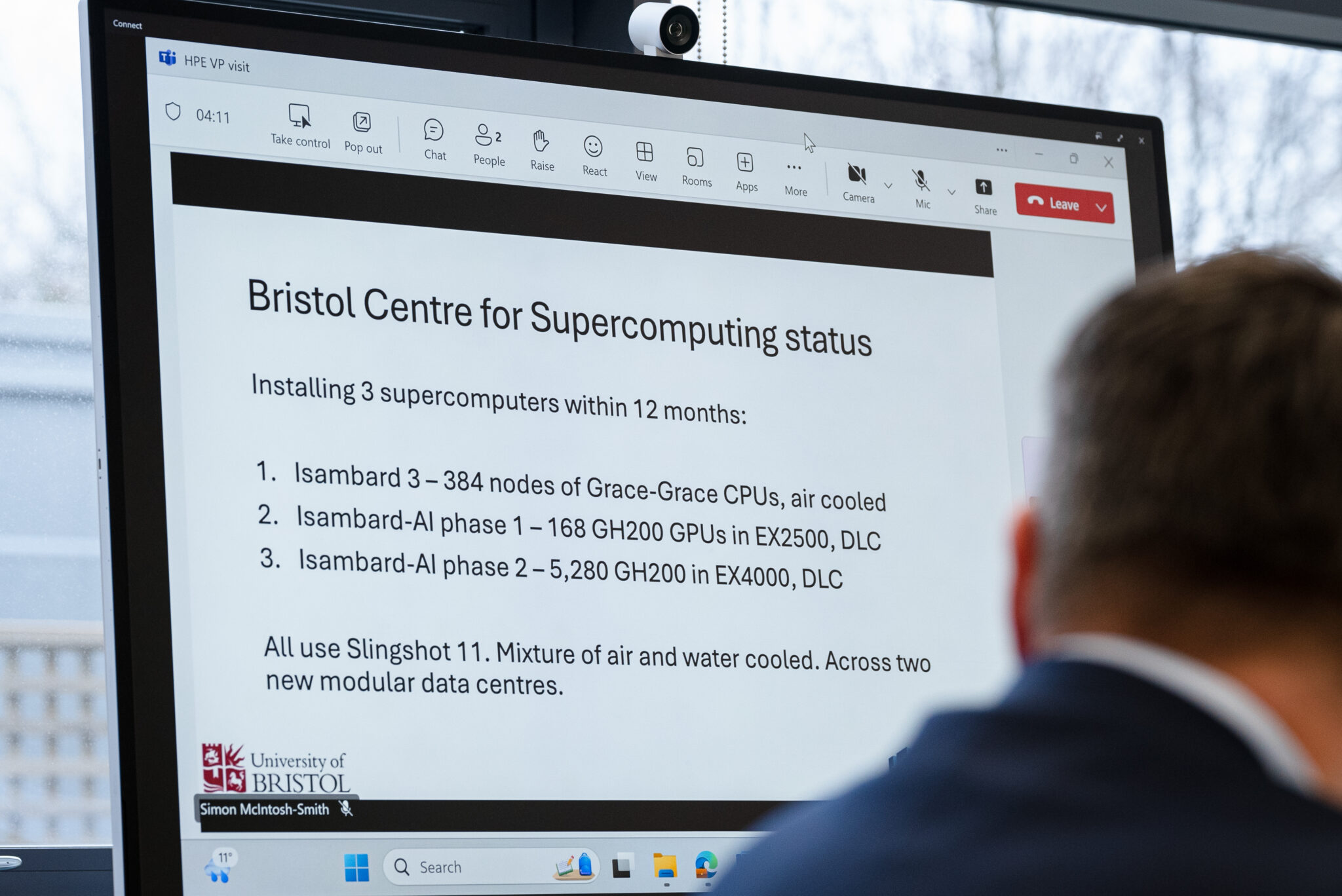 A glimpse into the project’s strategic planning, showing a screen outlining the ambitious goal of installing multiple supercomputers, including Isambard-AI’s phases, within 12 months.