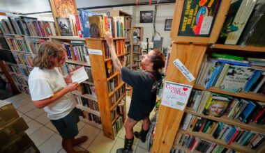 Andrew Higgins and Savannah Shealy perused the biography section of the Green Hand Bookstore in Portland, Maine, on Aug. 7.