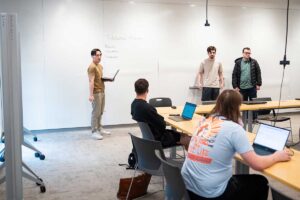 Nathan Dinh '25 presenting his final project to his CS 200 classmates