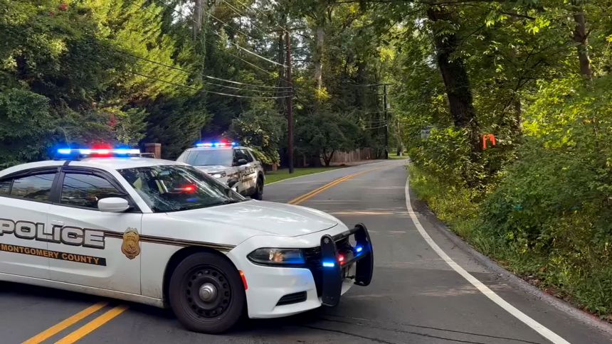 Police activity and federal law enforcement were observed outside Bolton's home.