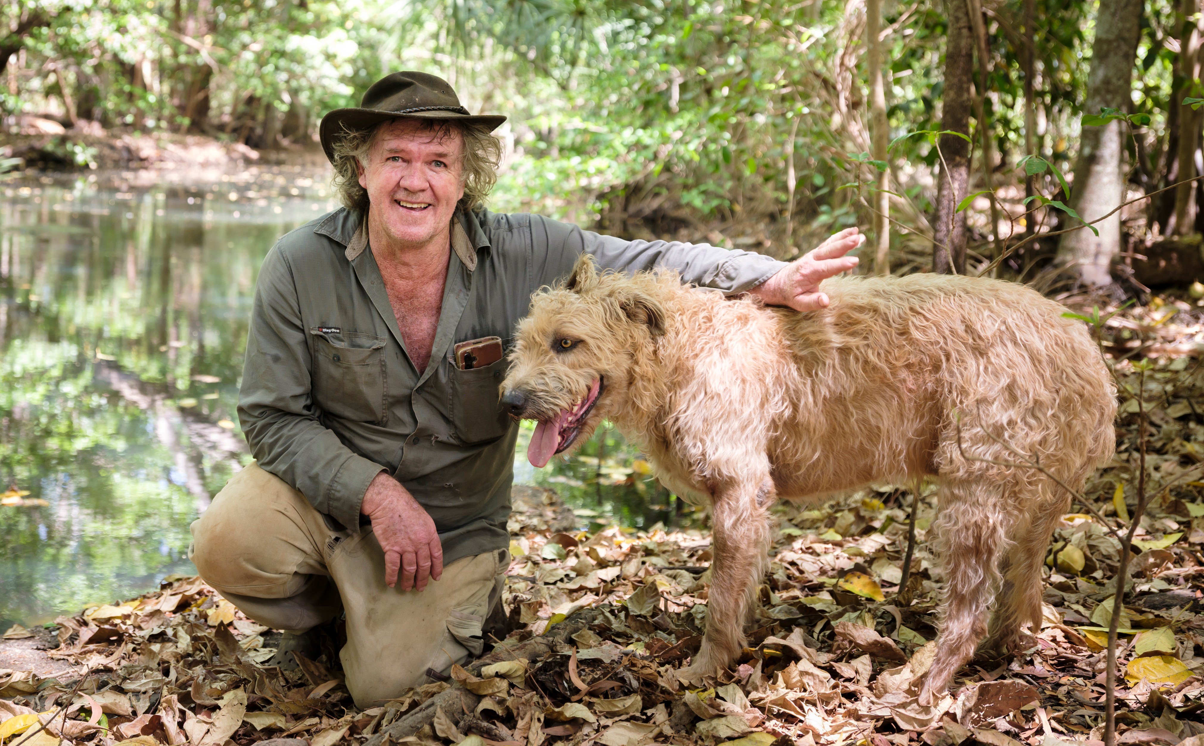 Trevor Sullivan with his dog by a freshwater spring.