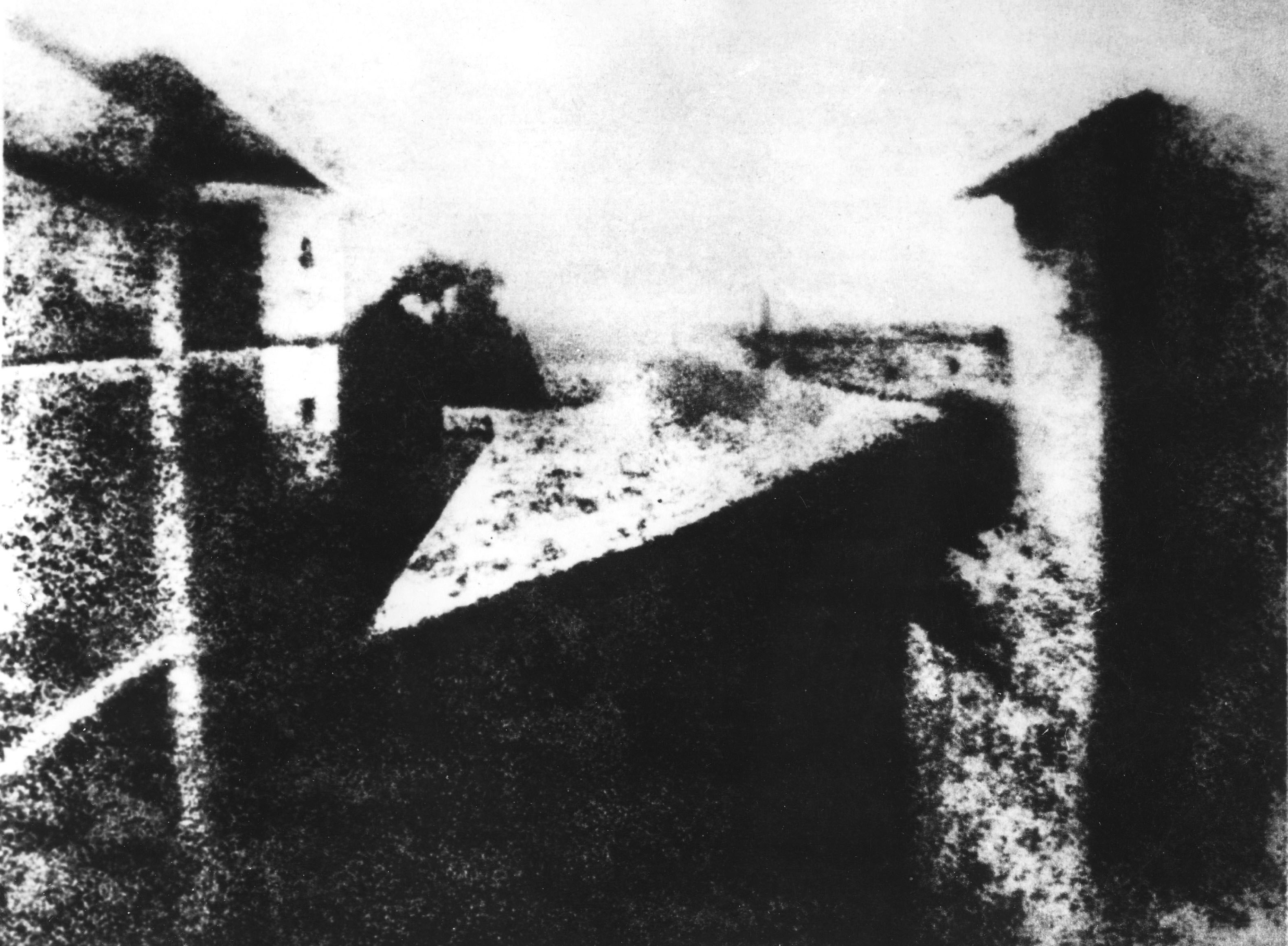 Niepce's 1826 heliogravure, the first photograph, depicting a view from a window.