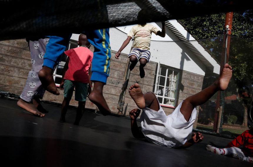 Children play on a trampoline at the Nyumbani Children's Home in Kenya, which cares for more than 100 children with HIV, whose parents died of the disease, while providing them with US-funded supplies of antiretroviral medicines.
