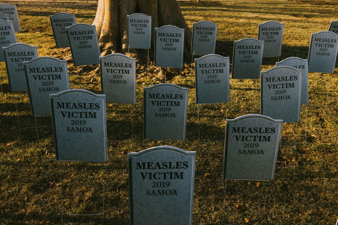 Fake gravestones to signify the Somoa Measles victims of 2019 sit in the grass outside the US Capitol, as healthcare professionals join lawmakers for a news conference ahead of Robert F. Kennedy, Jr.'s confirmation hearing on January 29.