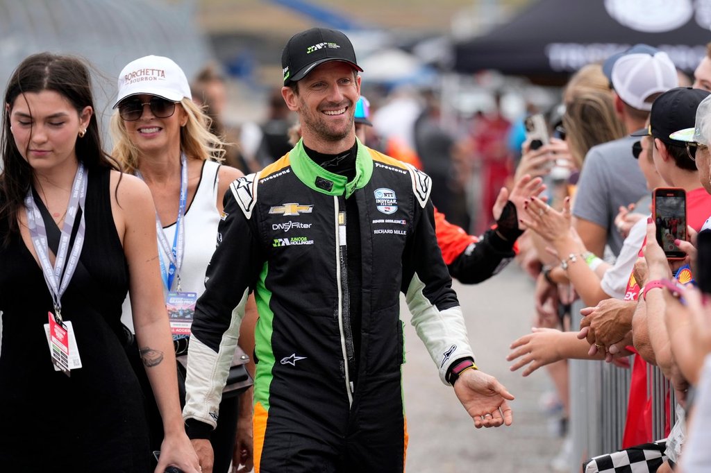 FILE -Romain Grosjean greets fans before an IndyCar auto race, Sept. 15, 2024, at the Nashville Superspeedway in Lebanon, Tenn. (AP Photo/Mark Humphrey, File)