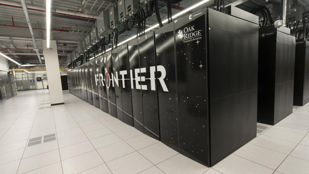 The Frontier supercomputer at ORNL is pictured as several rows of black cabinets