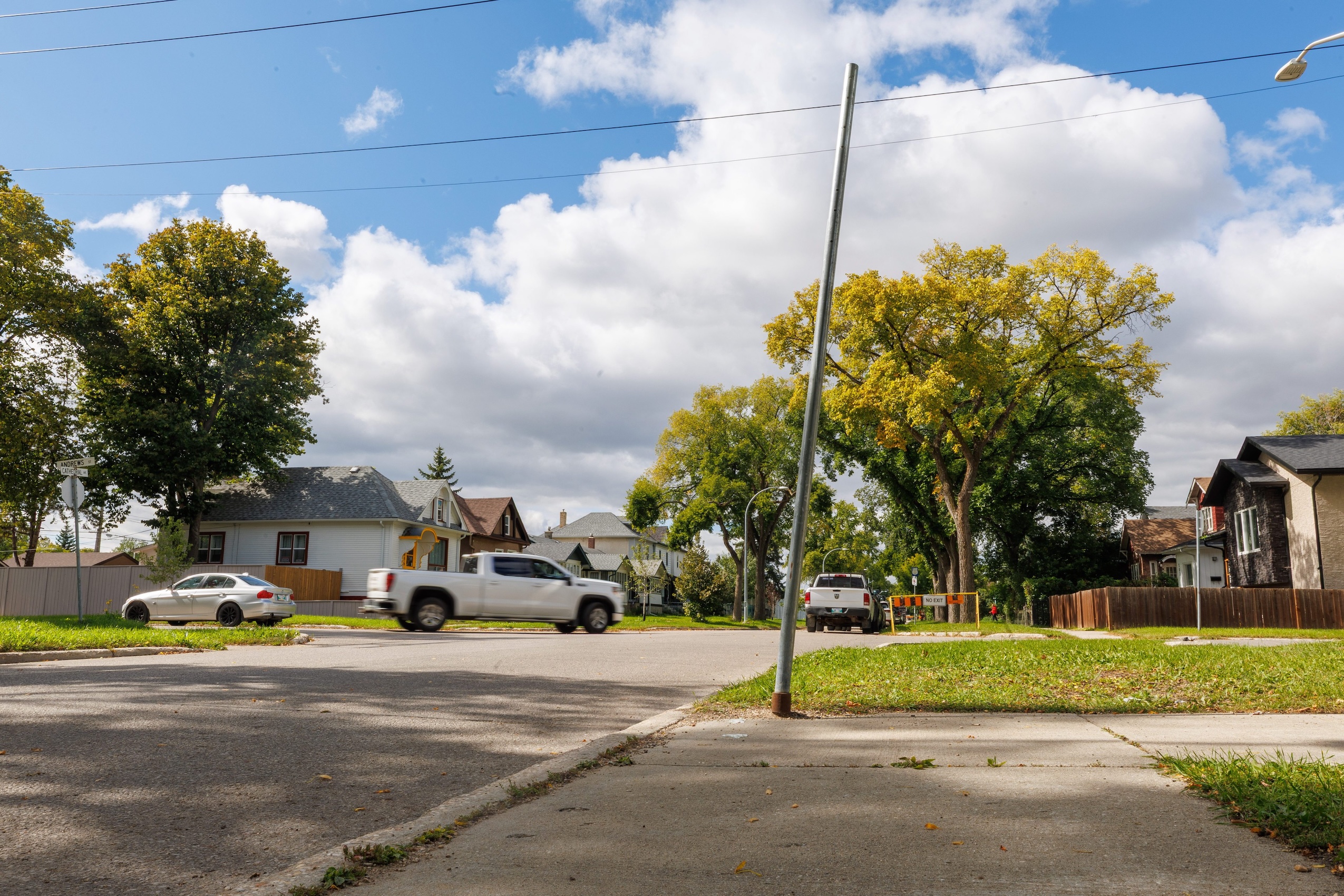 A leaning blank pole stands where a Winnipeg Transit bus stop used to be in the city's north end
