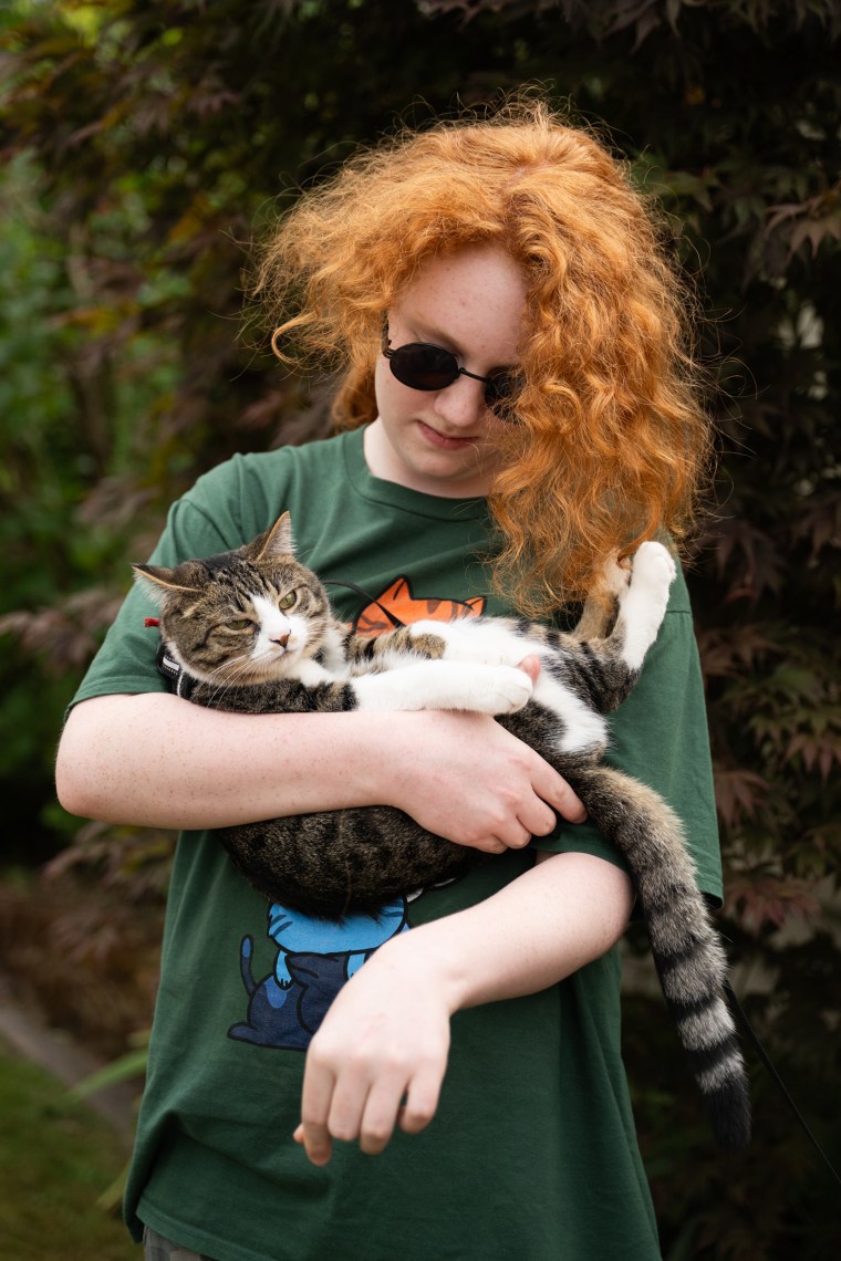 Adam with the family cat.