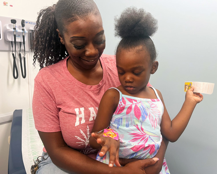 Kimberly Jones with her youngest child, 4-year-old Za’riyah. Jones has become increasingly skeptical of vaccines in recent years.