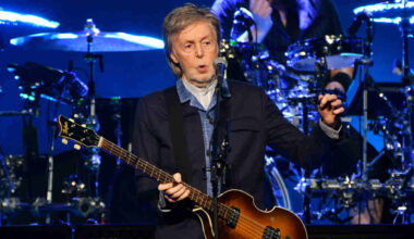 Paul McCartney performing onstage in 2024