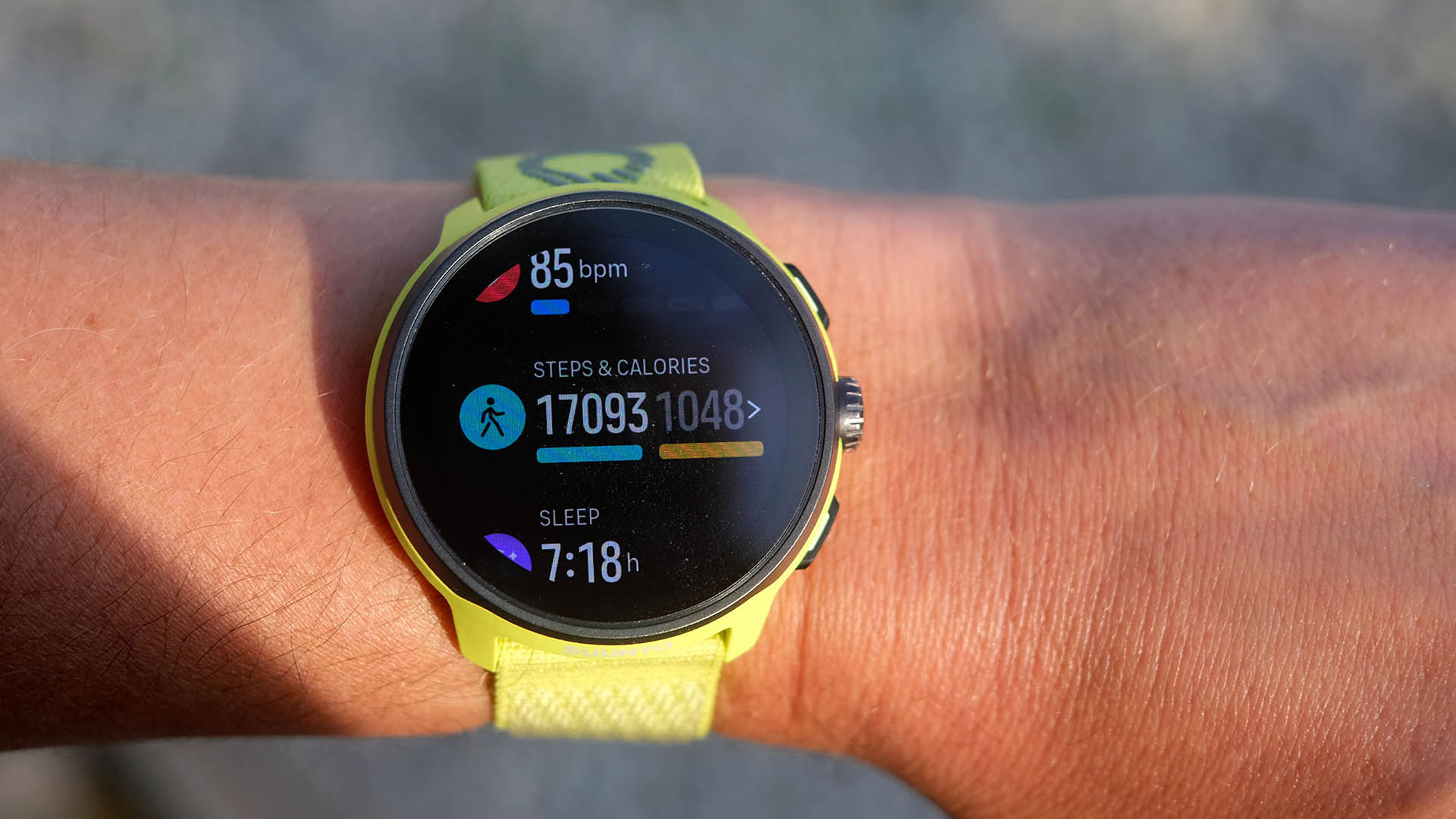 A close-up picture of daily fitness stats in the Suunto Run watch