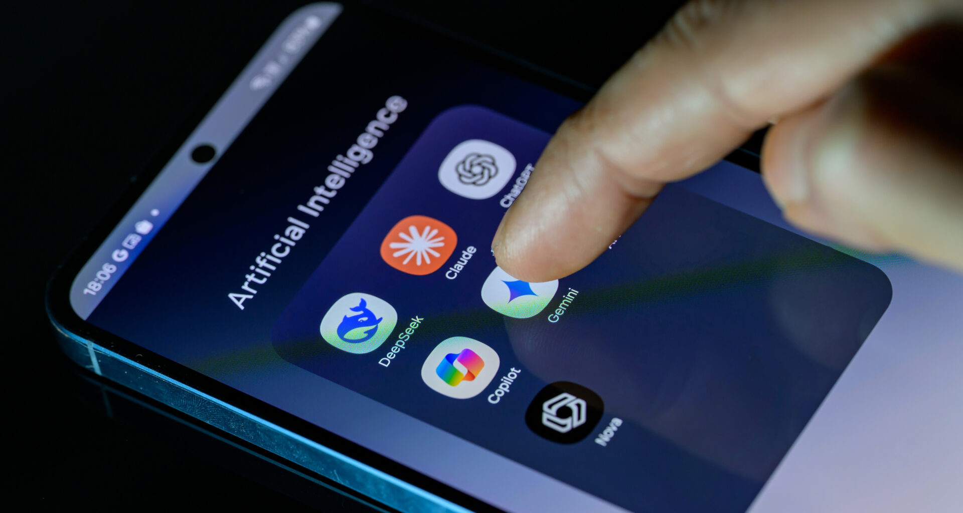 A photo of someone's smartphone with a folder full of AI apps: DeepSeek, Claude, ChatGPT, Copilot, Gemini, AI Photo, and Nova.