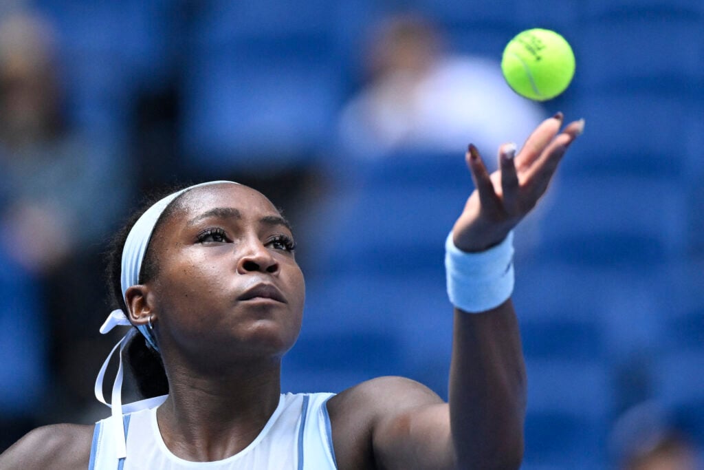 Coco Gauff throws the ball up to serve at the 2025 China Open