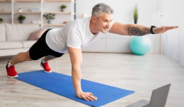 Older man performing one-arm plank on exercise mat at home during ab workout