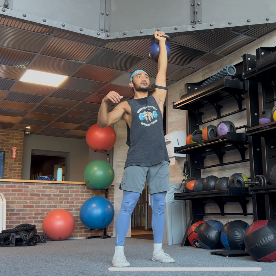 Man exercising with kettlebell