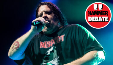 Cannibal Corpse singer Corpsegrinder onstage in 2023, with a logo saying "Hammer Debate" in-set