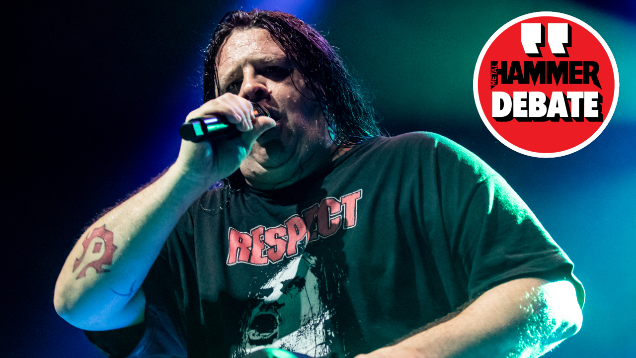 Cannibal Corpse singer Corpsegrinder onstage in 2023, with a logo saying "Hammer Debate" in-set