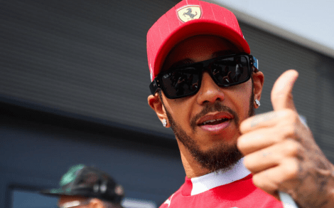 Thumbs up in Ferrari team attire.