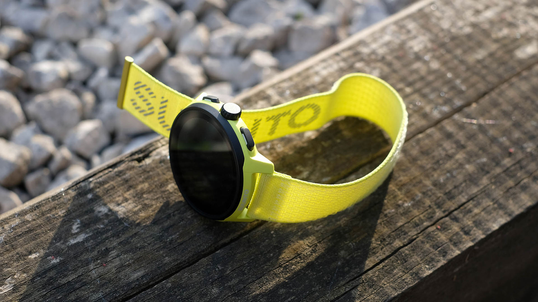 Suunto Run watch on a table outside, view from above