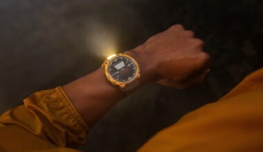 A photo of the Garmin Instinct Crossover AMOLED watch with the flashlight active on a person's wrist at night