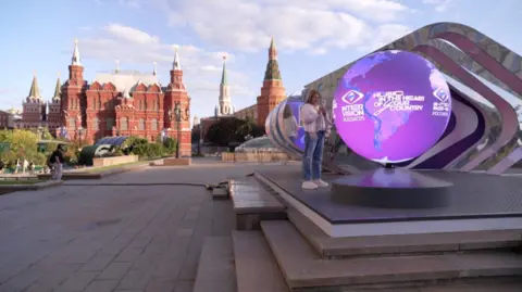 A sphere with an advert for the Intervision song contest sits in Moscow