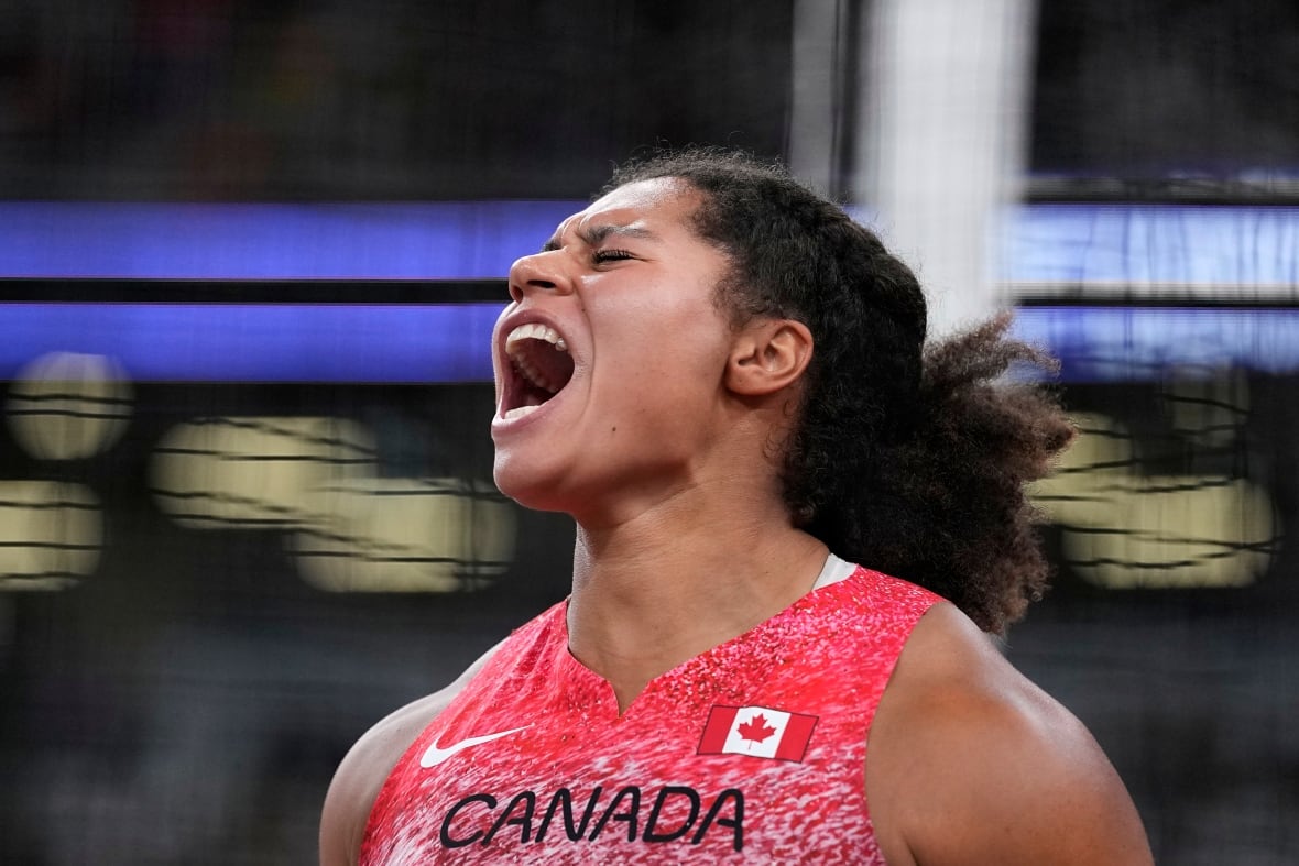 A jubilant female shot putter.