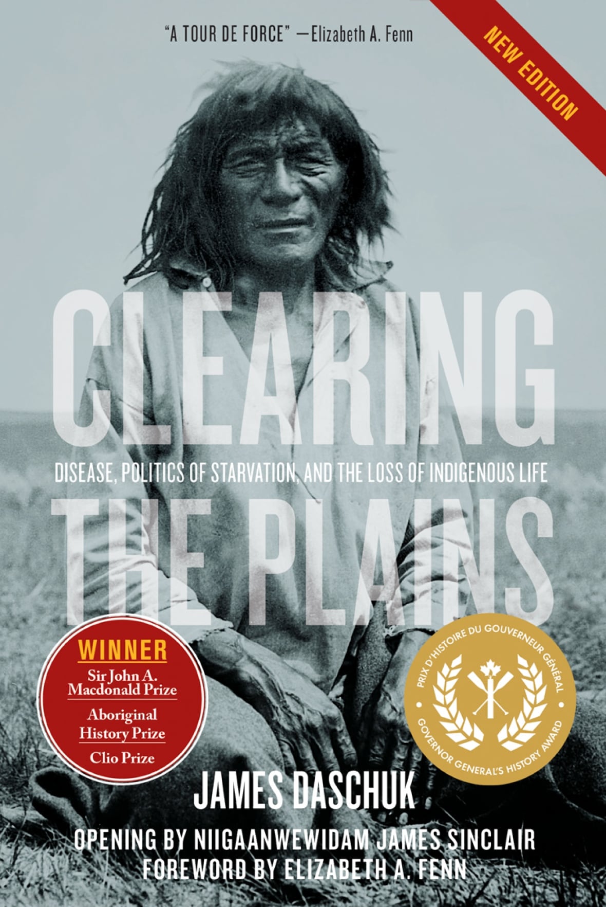 A grey book cover with a historical photo of an older Indigenous man. The text is transparent and covers the image.