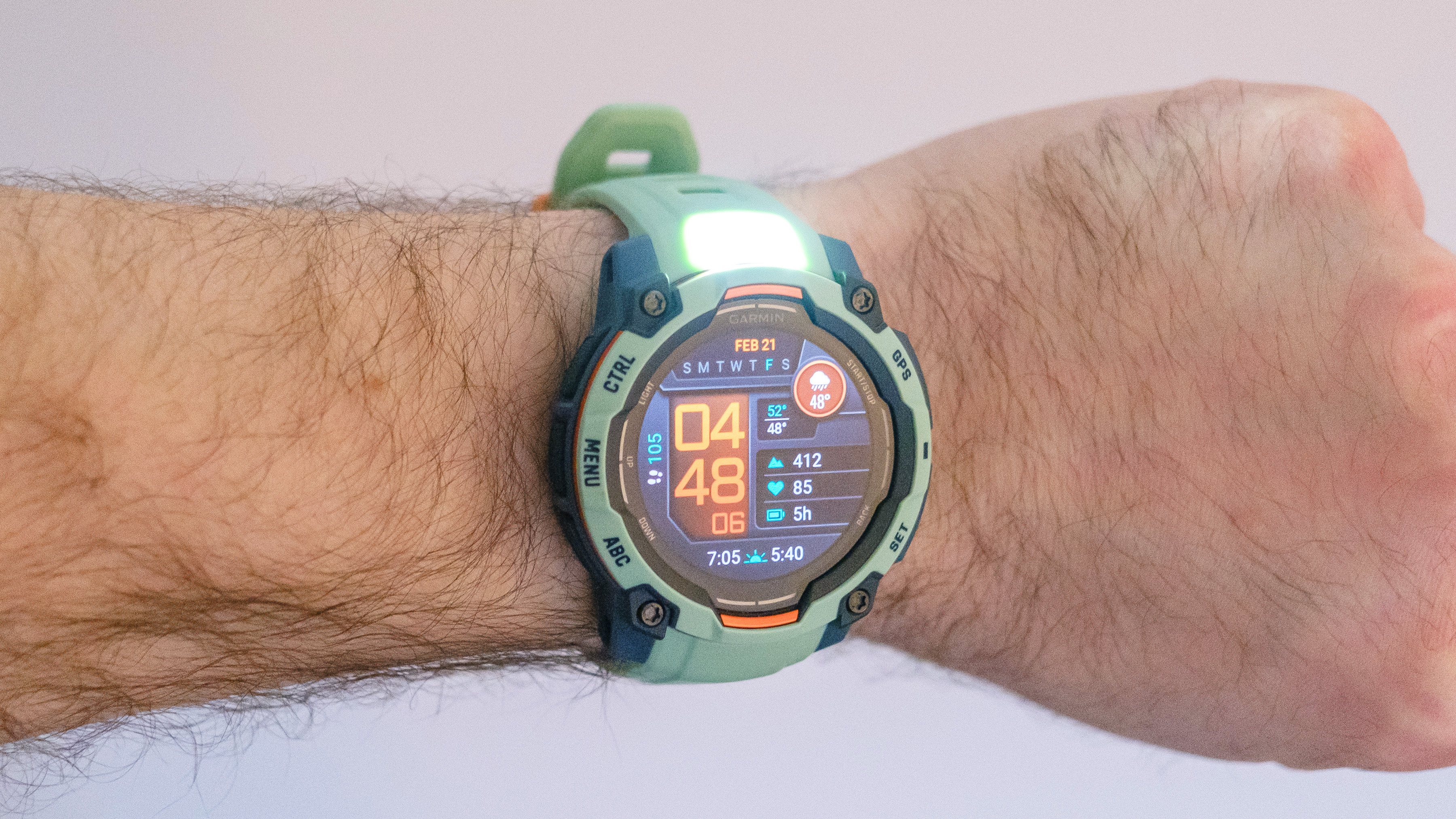 Close-up of the Garmin Instinct 3 on a user's wrist