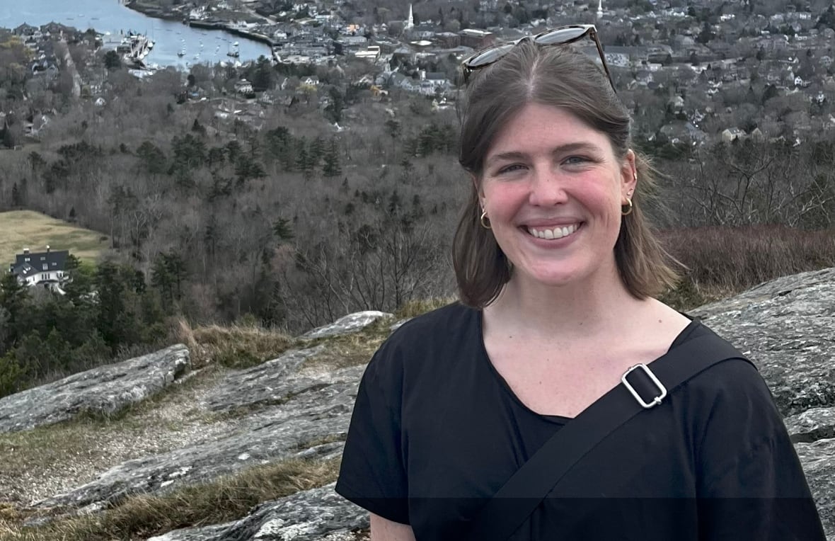 A woman poses for a photo