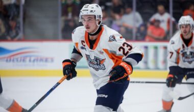 Clattenburg fights, finds net as Oilers fall to Flames in rookie Battle of Alberta