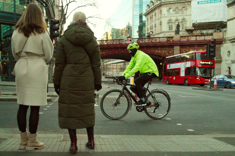 Cyclist in London with pedestrians in foreground
