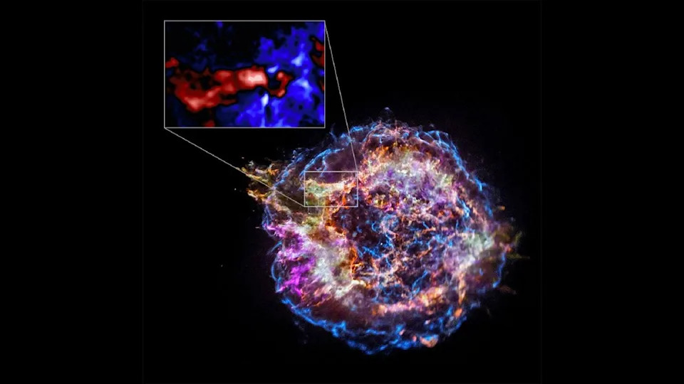  An image of the Cassiopeia A supernova with an inset showing a zoomed in portion. 