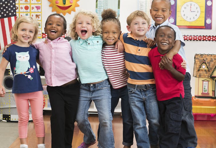 A group of kindergarten-age kids in a classroom