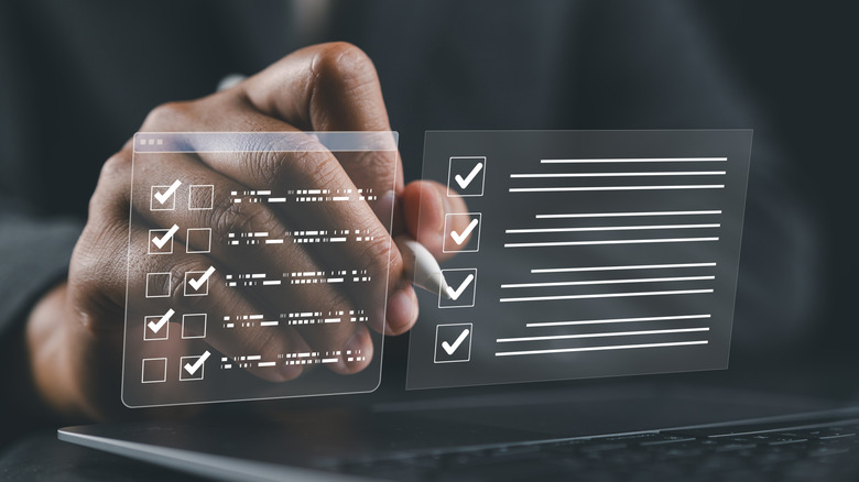 person holding stylus and evaluating