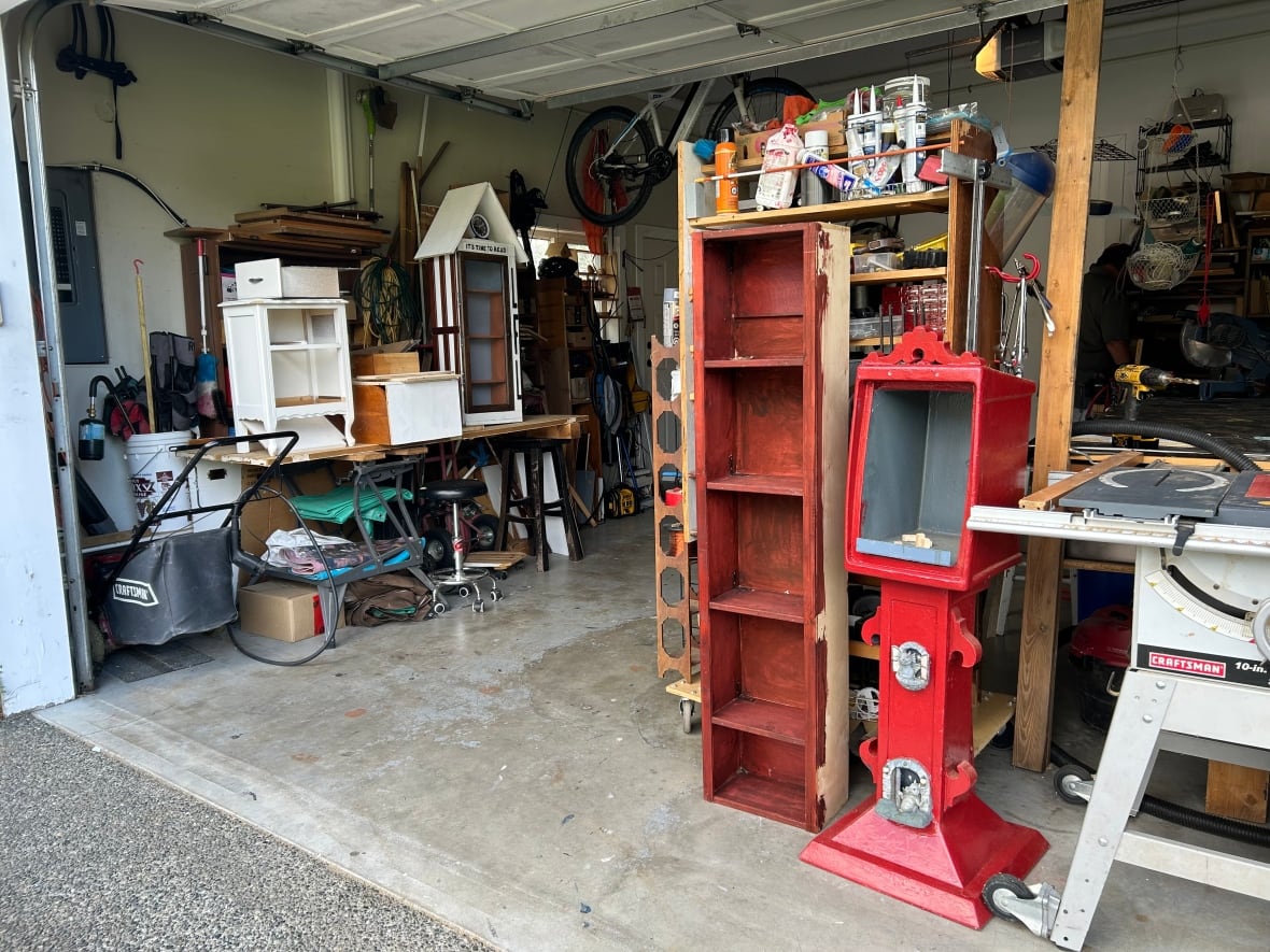 A garage filled with numerous wooden projects and tools. 
