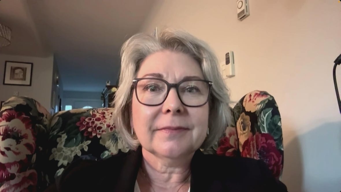 A woman speaks over Zoom