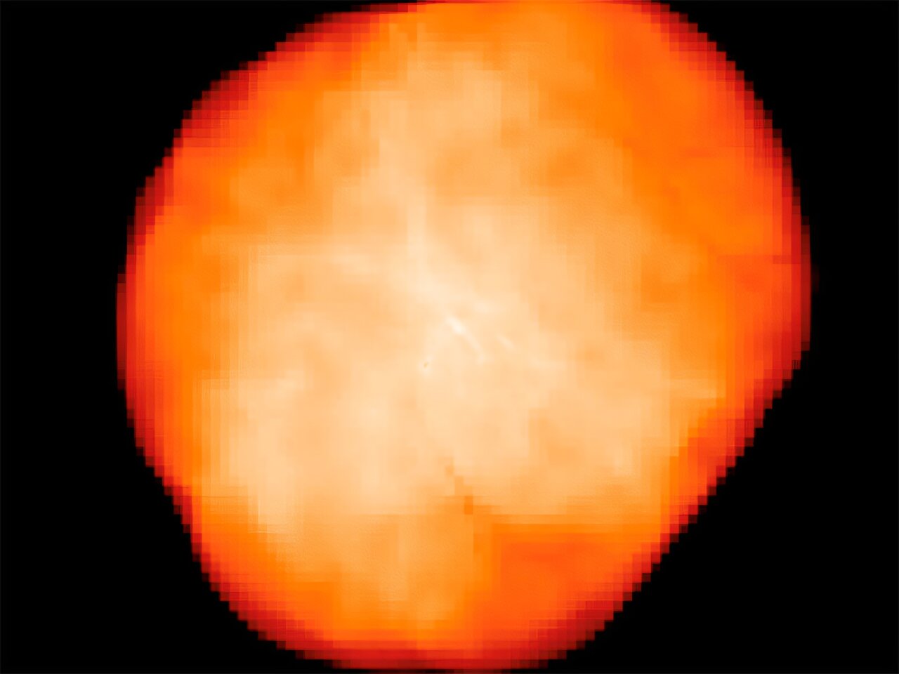 A bright, orange-red, irregularly shaped mass with a textured surface evokes the fiery birth of early supermassive stars, set against a solid black background.