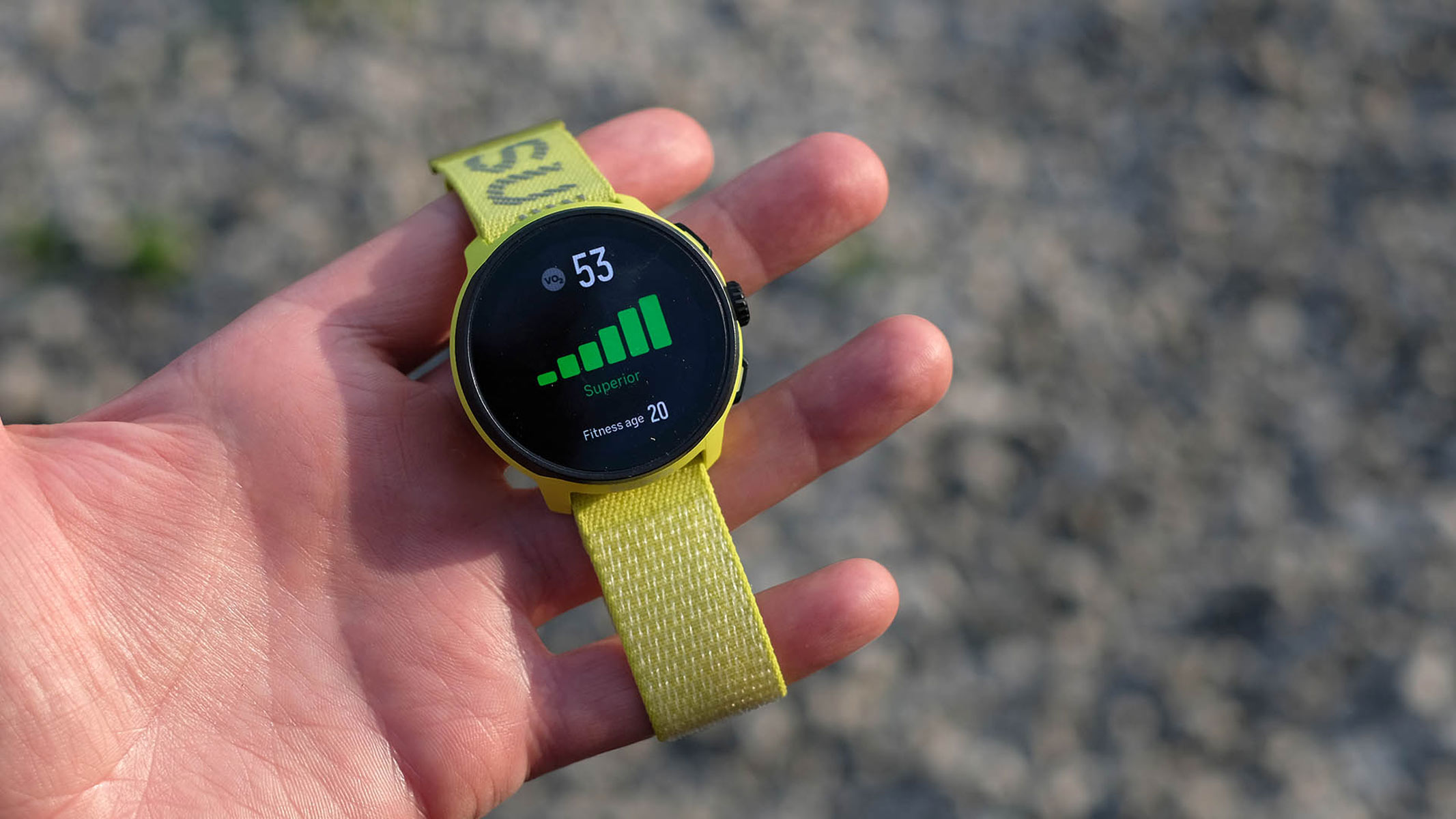 A close-up picture of our reviewer holding the Suunto Run watch