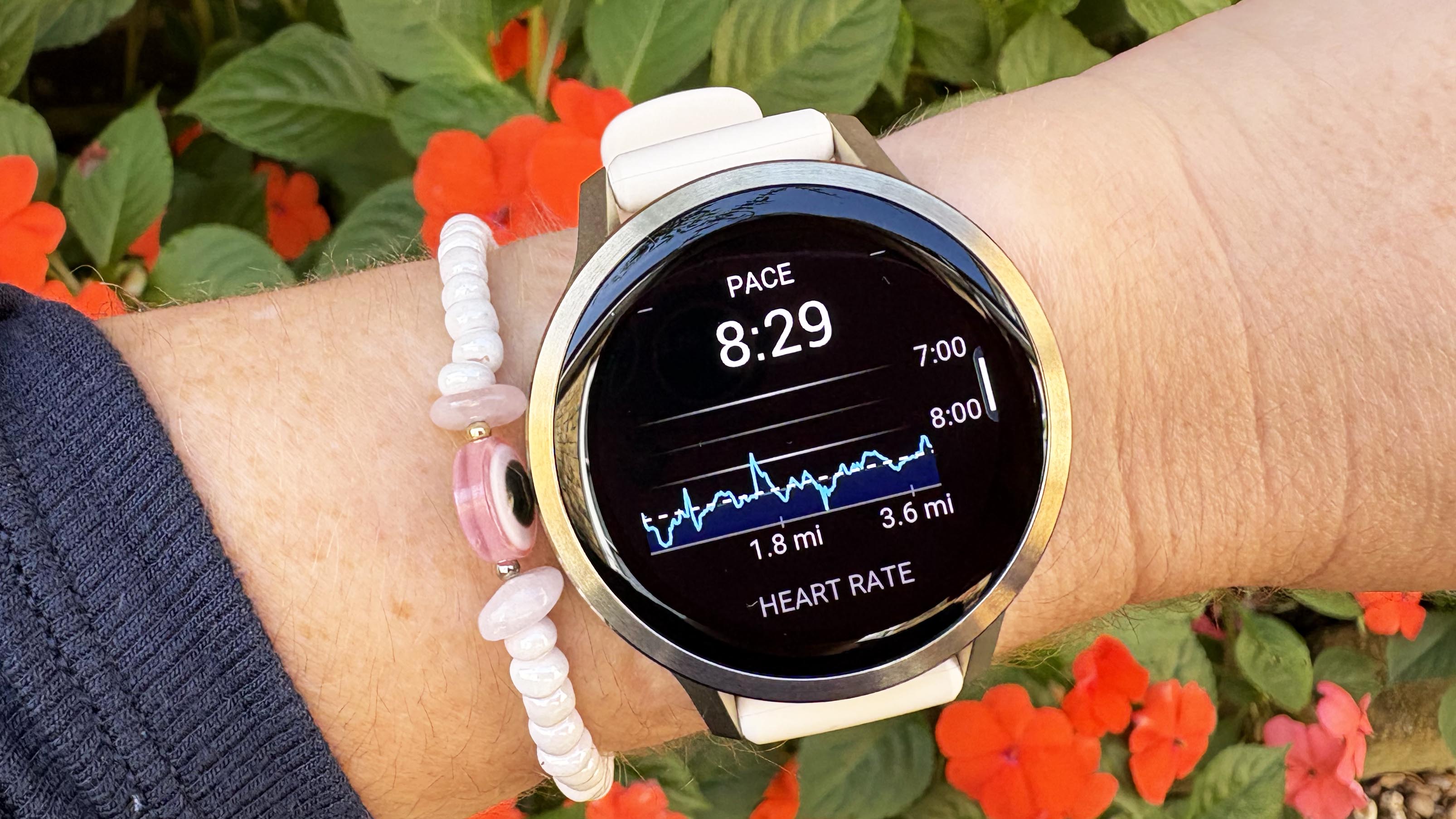the Garmin Venu 4 in lunar gold on the wrist
