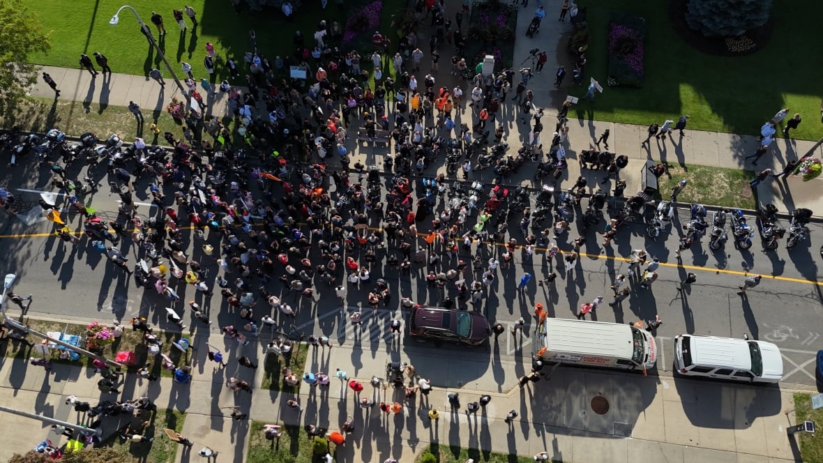 aerial shot of crowd outside courthouse