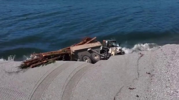 Dramatic shoreline collapse sends huge truck into B.C. lake