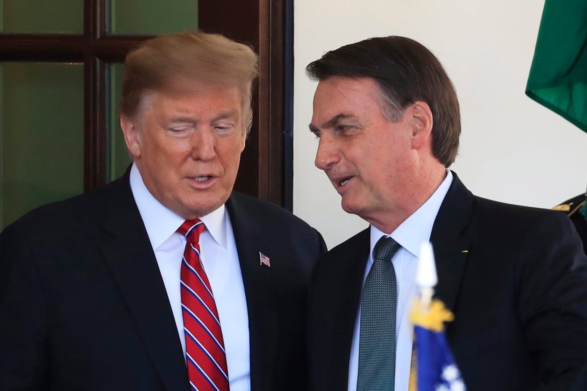 Two people are seen speaking.