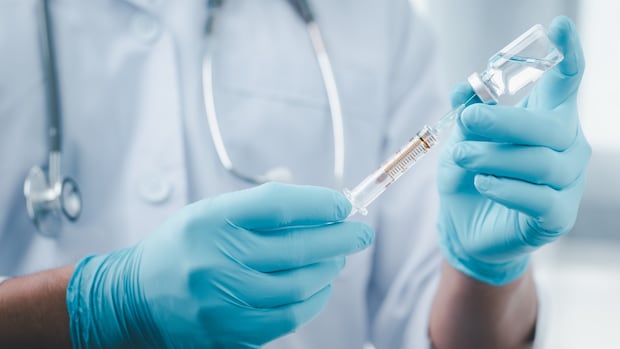 Minister defends Alberta's plan to charge some people for COVID-19 vaccines