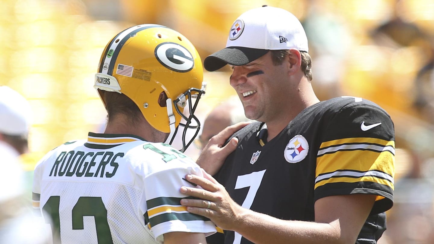 Comparing rookie cards of two NFL legends