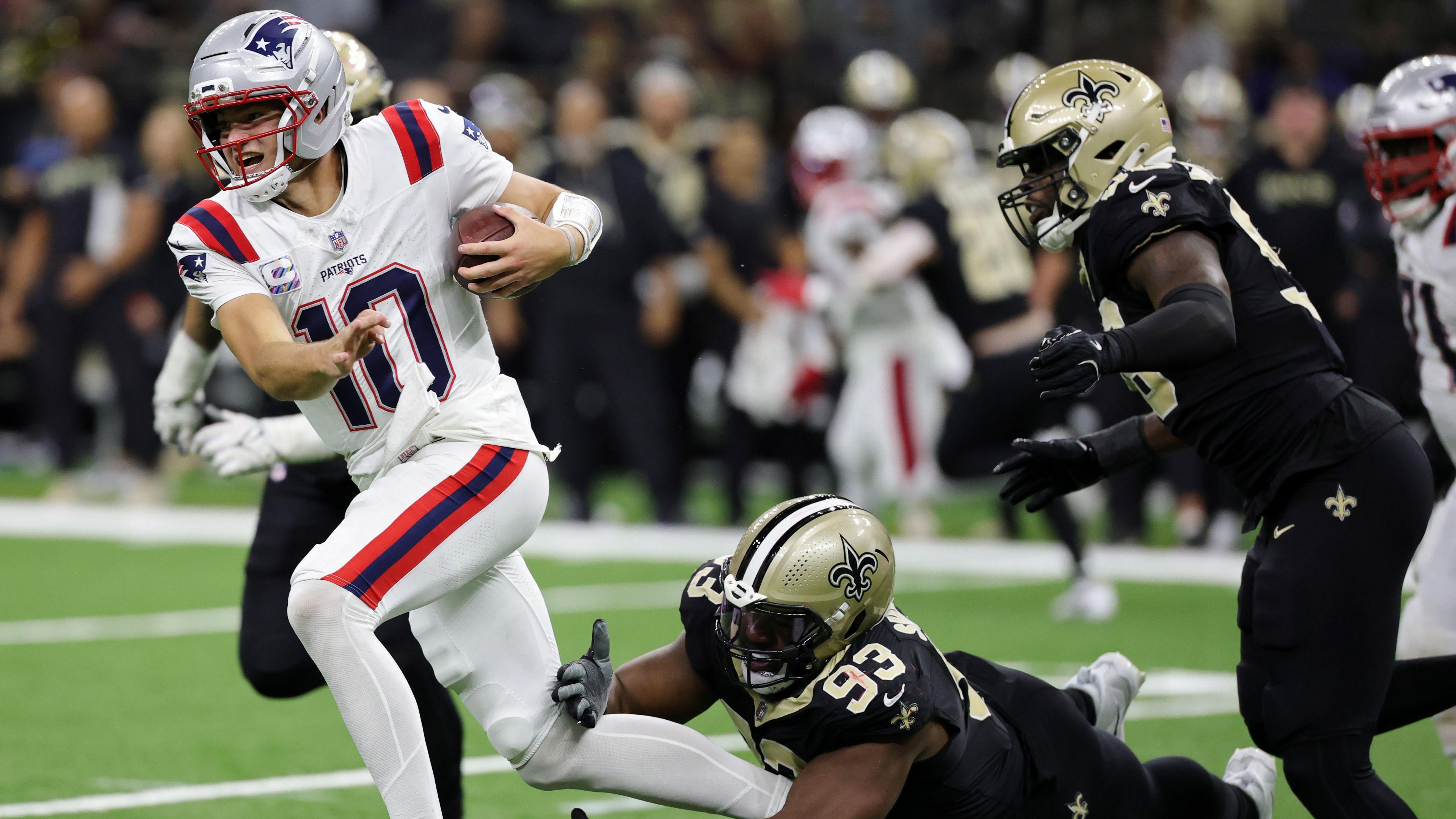 New England Patriots quarterback Drake Maye runs away from the New Orleans Saints defence in the NFL