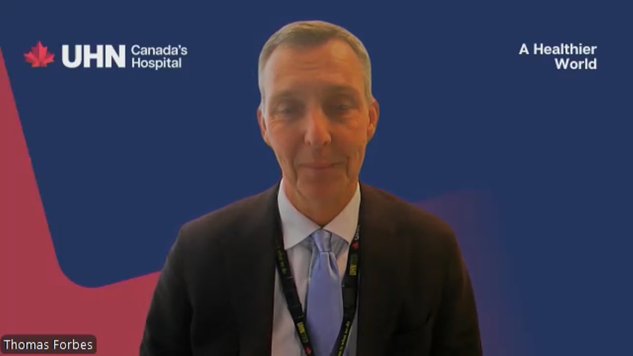 Zoom screenshot of a man in a suit.