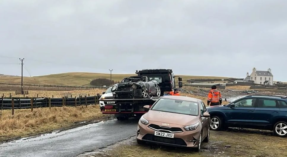 Aren Pearson's Porsche is loaded on a trailer after being pulled from the North Sea not far from where Claire Leveque was found dead of stab wounds.