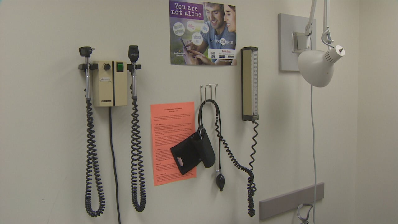 This medical equipment is similar to what you would have seen in a doctor's office decades ago, but patient care has become more complex, says Stockley. (Mark Quinn/CBC) Medical equipment including scopes, blood pressure monitor, and a secondary source of light are seen hung on the wall of an examination room.