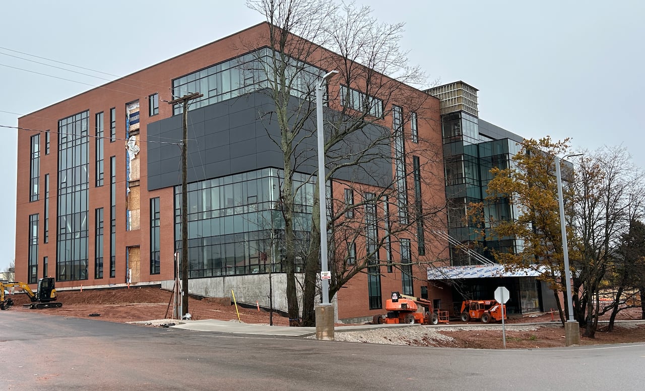 Brick building with large windows.